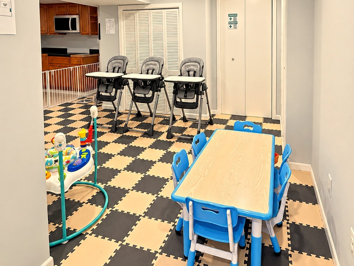 Dining room with child-size table, blue chairs, and high chairs